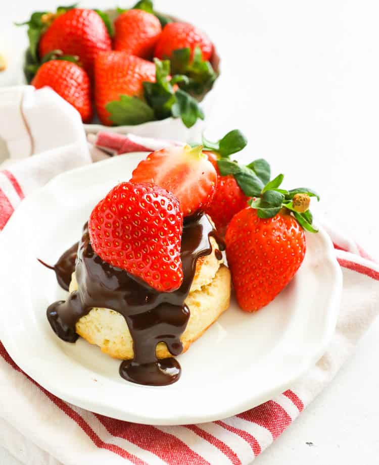 biscuit topped with chocolate gravy and strawberries