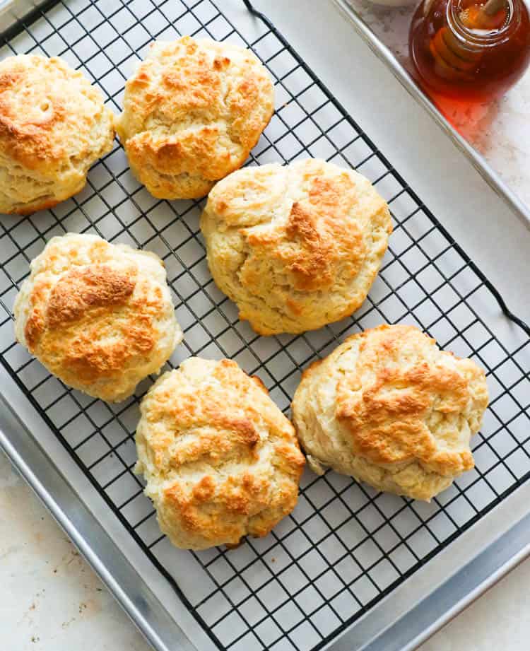 Line of Southern Cathead Biscuits on a cooling rack