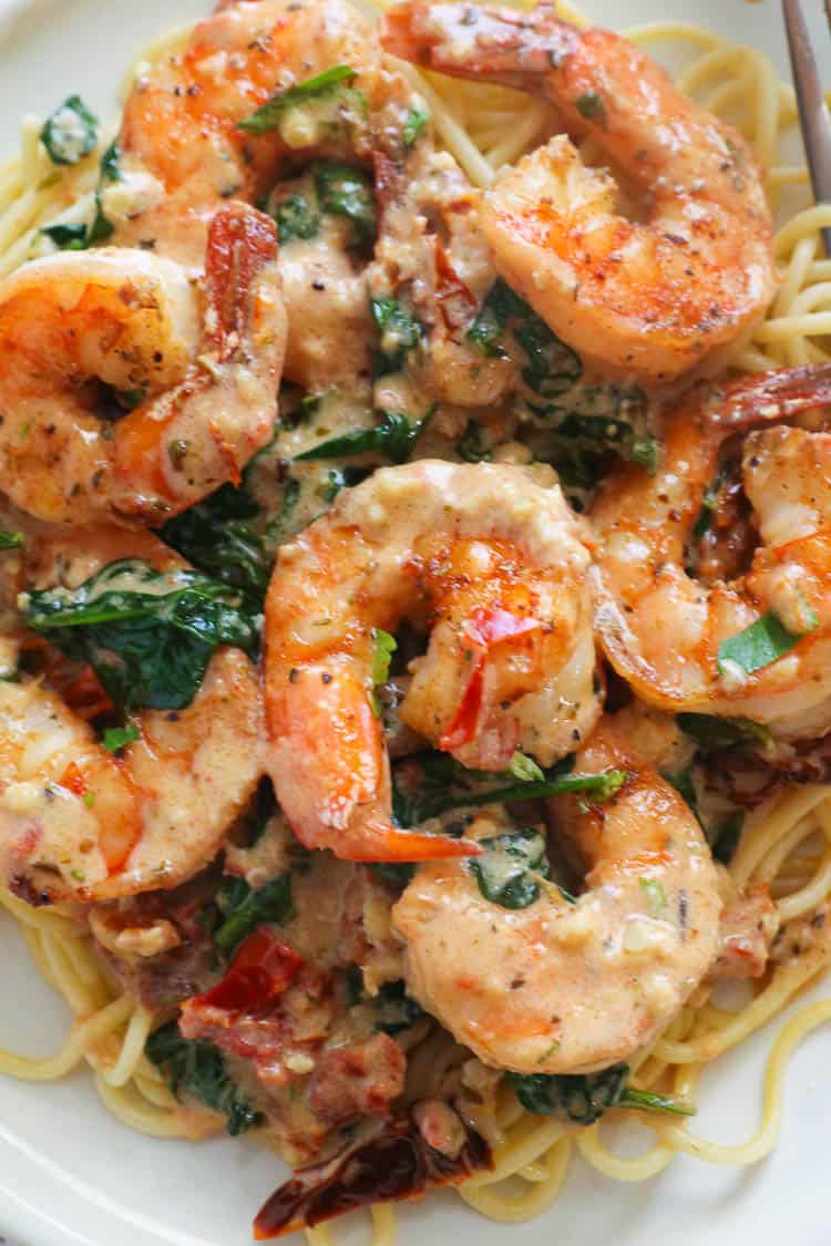 Tuscan Shrimp Served Over Cooked Pasta