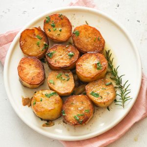 fondant potatoes on a white plate