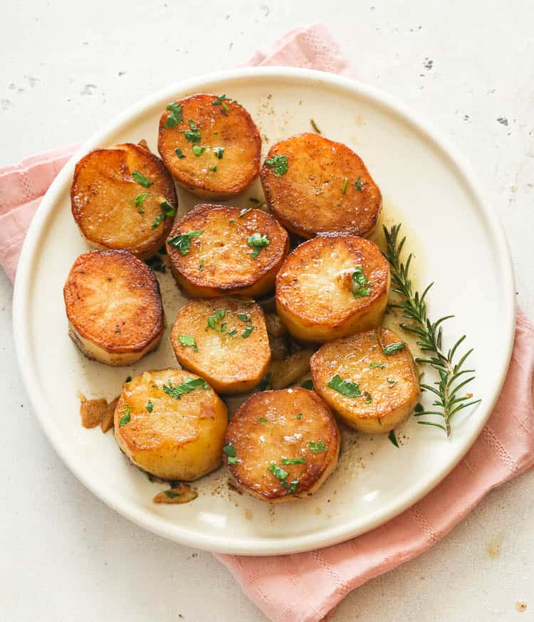 fondant potatoes on a white plate