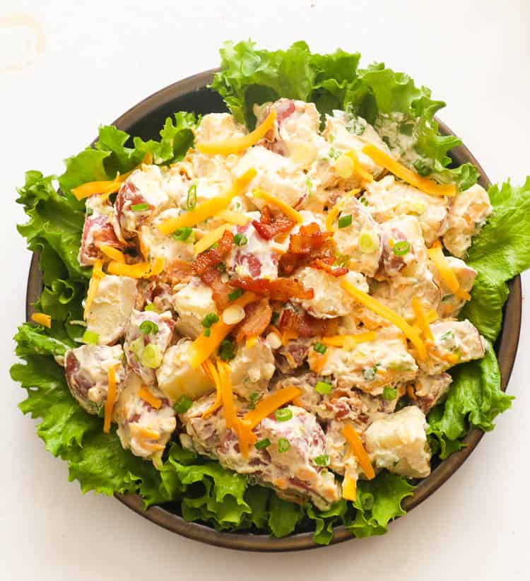 ranch potato salad on a bowl with lettuce