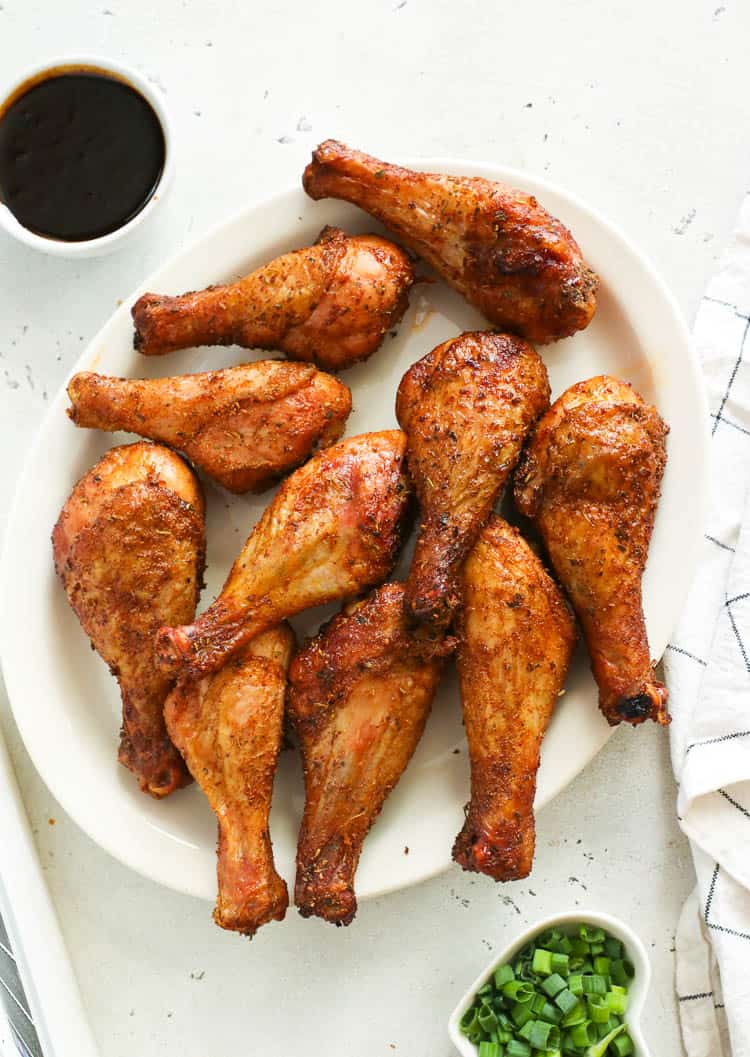 Smoked chicken legs in a long plate dish