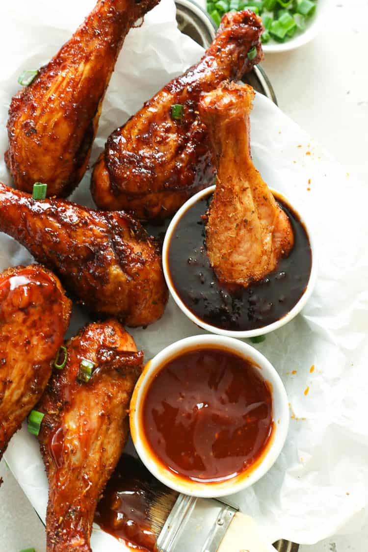 cmoked chicken leg dipped in a barbecue sauce