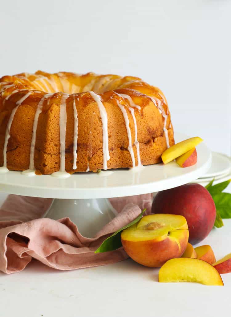 Peach Cobbler Pound Cake on a cake stand