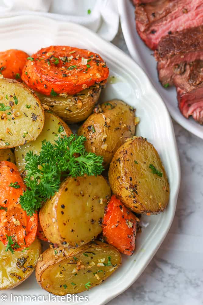 Roasted Potatoes and Carrots topped with fresh pasley