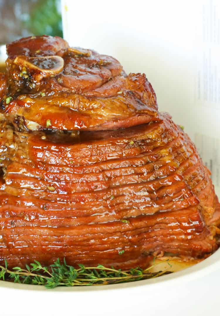 Slow Cooker Ham served on a plate with Thyme