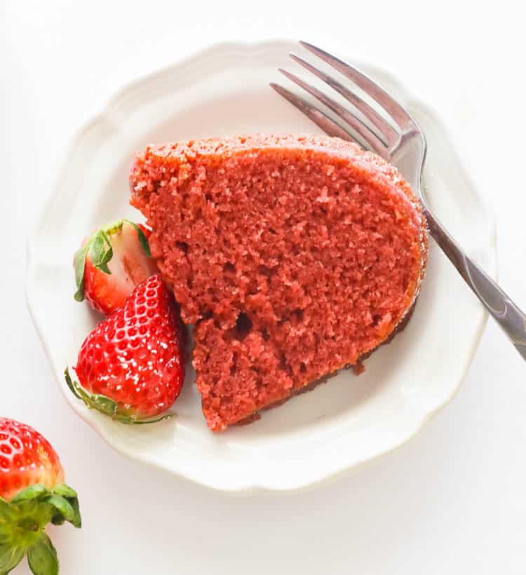 A Slice of Strawberry Pound Cake on a White Plate