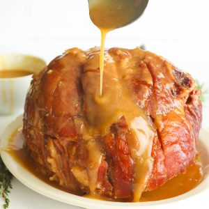 A Slow Cooker Whole Ham glazed with Honey mixture