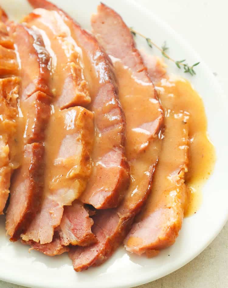 Sliced Slow Cooker Ham glazed with Honey mixture