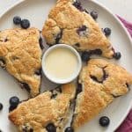 Lemon Blueberry Scones served on a plate with a dip