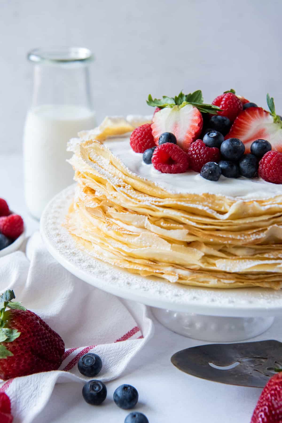 Crepe Cake with Berries on a White Plate