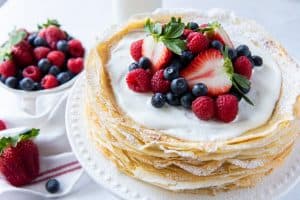 Crepe Cake with Berries on White Plate