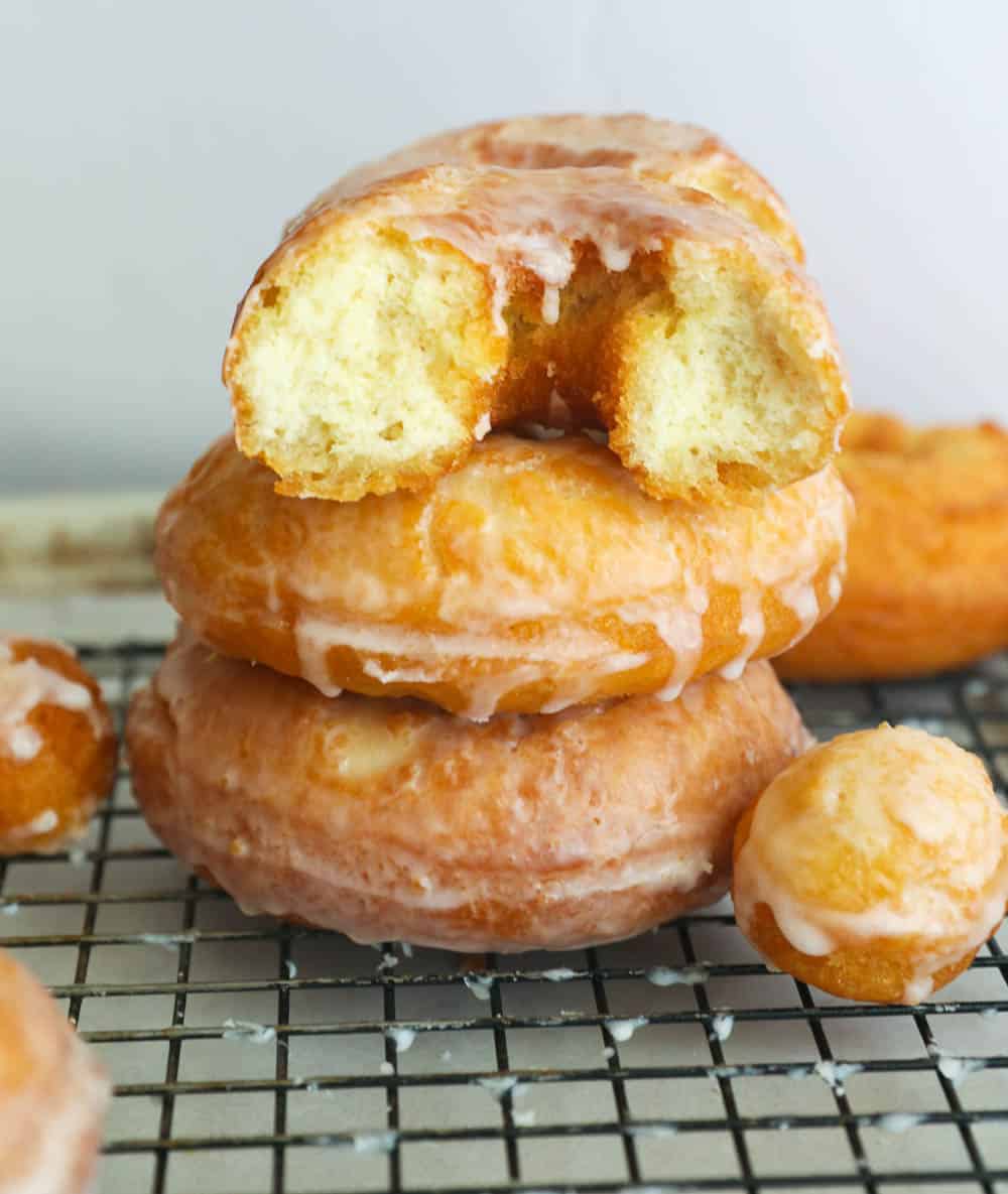 A tower of 3 donuts on a wire rack