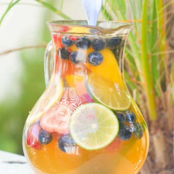 White Sangria in a pitcher with refreshing fruit