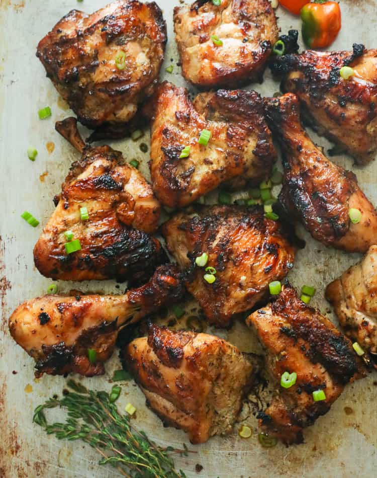 Insanely good Jamaican Jerk Chicken garnished with Thyme