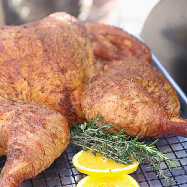 Freshly smoked spatchcocked turkey ready for an impressive Thanksgiving.