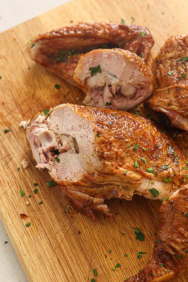 Sliced Turkey leg on a chopping board