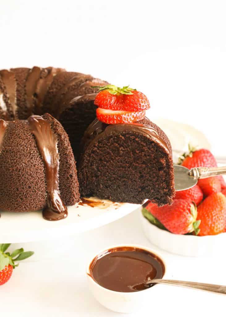 sliced whole chocolate pound cake with sliced strawberries