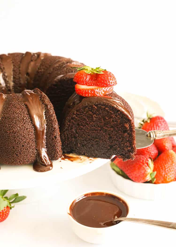 sliced whole chocolate pound cake with sliced strawberries