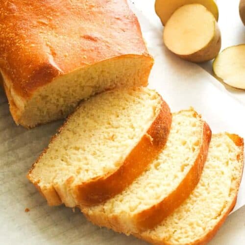 Slicing into freshly baked potato bread so soft and addictive.
