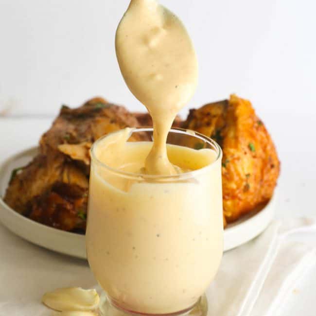 White BBQ Sauce dripping from spoon
