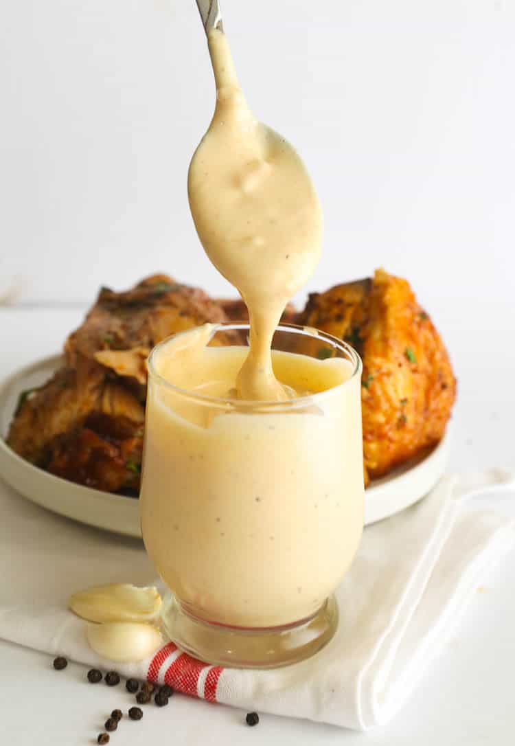 White BBQ Sauce dripping from spoon