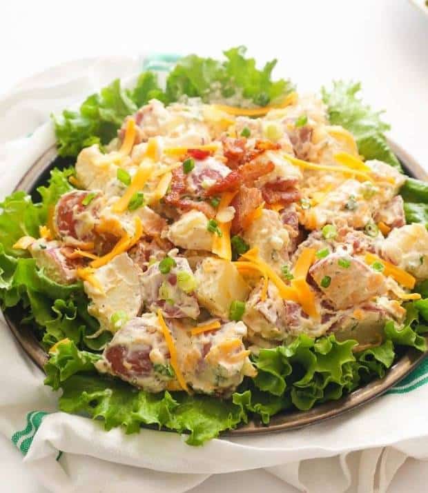 A bowl of Ranch Potato Salad served with lettuce