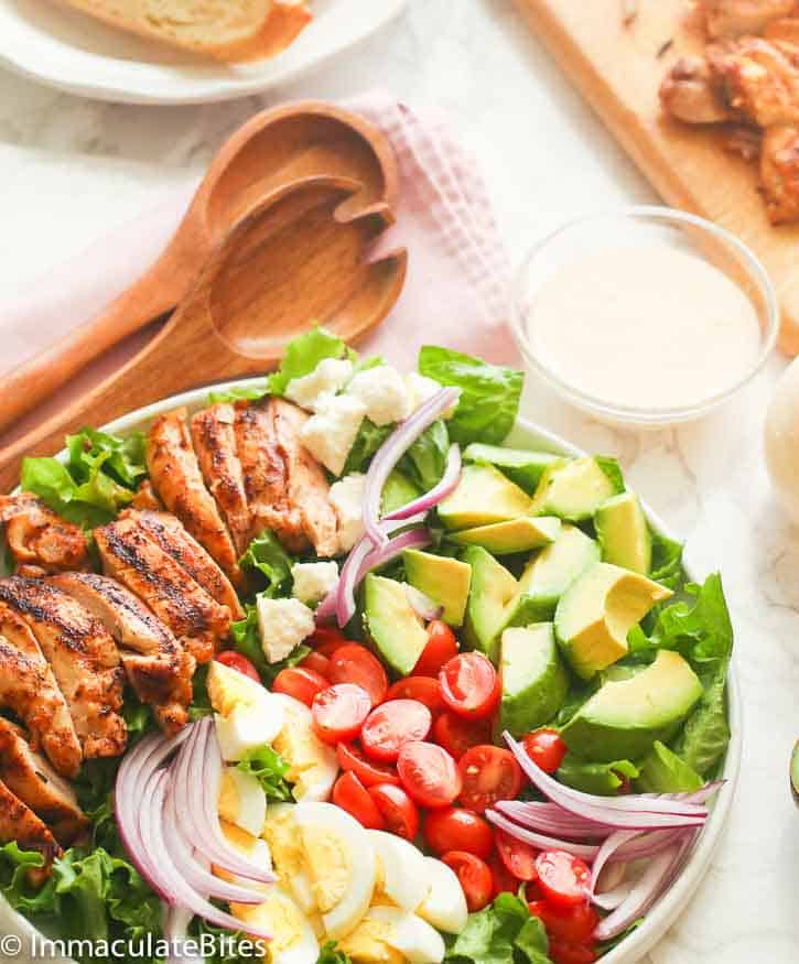 Cajun Chicken Avocado Salad with wooden spoon