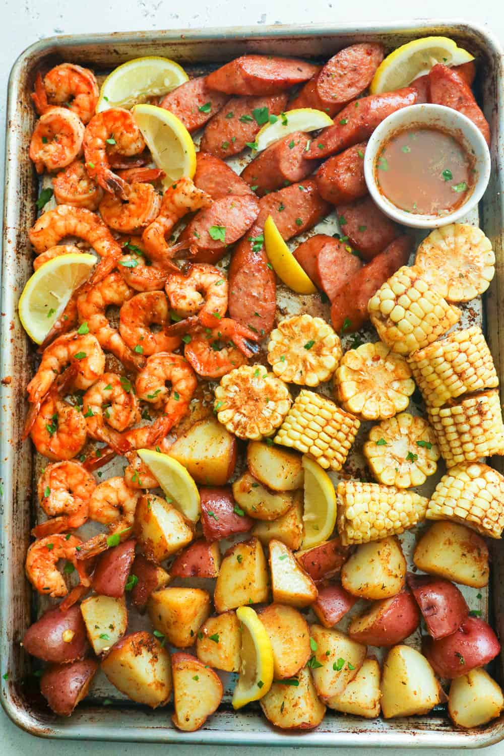 Cajun shrimp, red potatoes, sausage, and corn season with creole seasoning