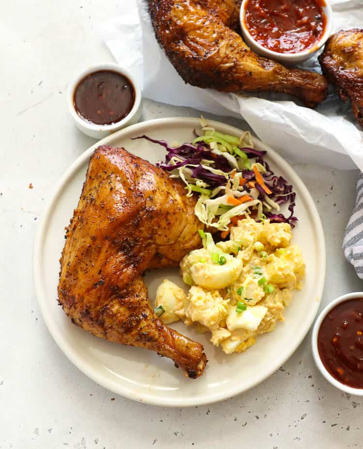 Chicken quarter with mashed potatoes and coleslaw