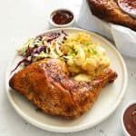 Chicken quarters with egg salad and coleslaw