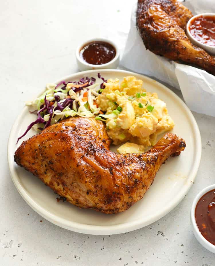 Chicken quarters with egg salad and coleslaw