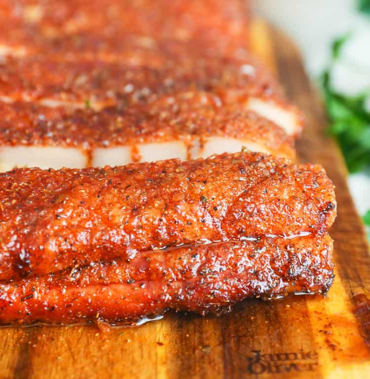 cross section of pork smoked belly on a chopping board