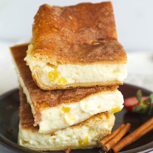 Sopapilla Cheesecake Bars served on a saucer