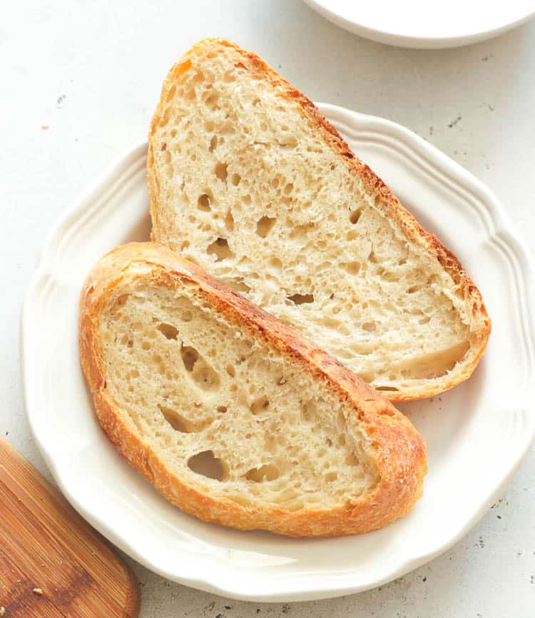 No-Knead Bread Sliced on white plate