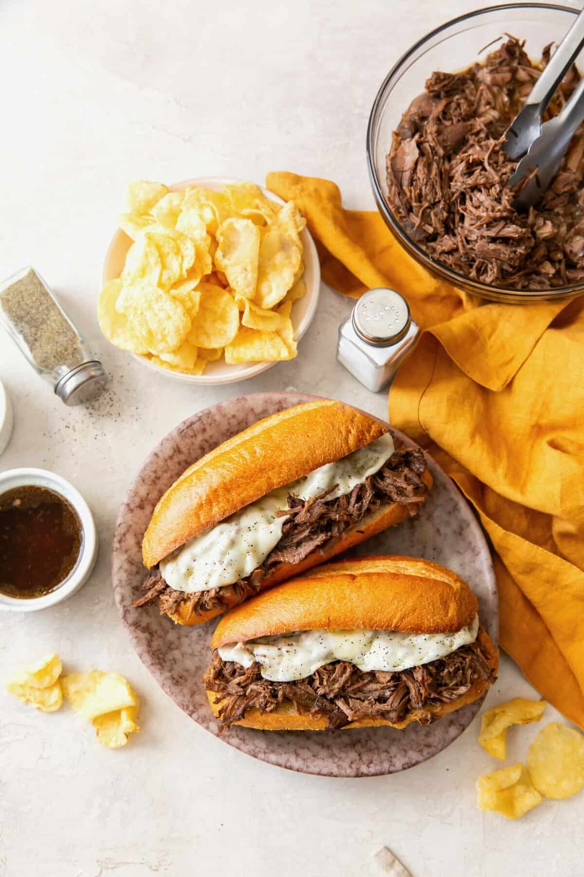 Freshly assembled Slow-Sooker French Dip Sandwiches ready to enjoy