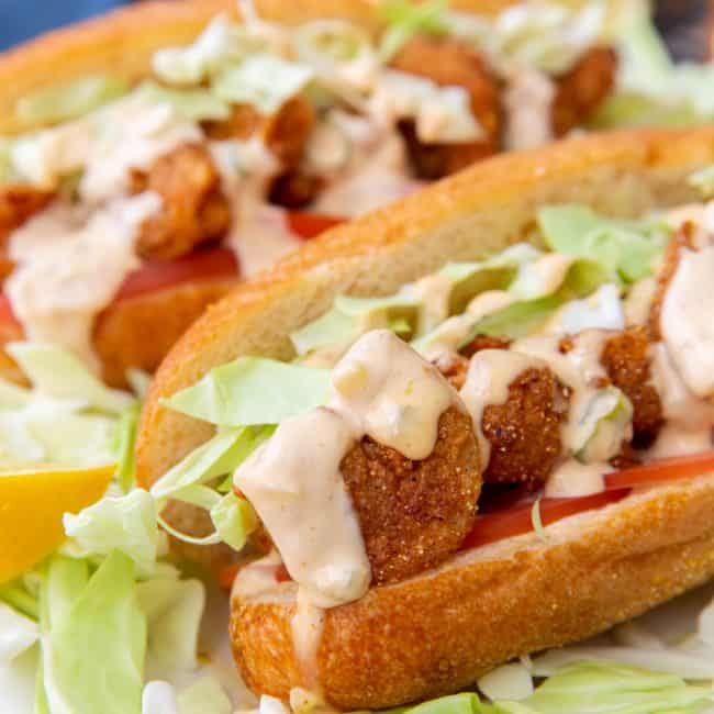 Upclose Shot Shrimp Po Boy Sandwich Drizzled with Remoulade Sauce