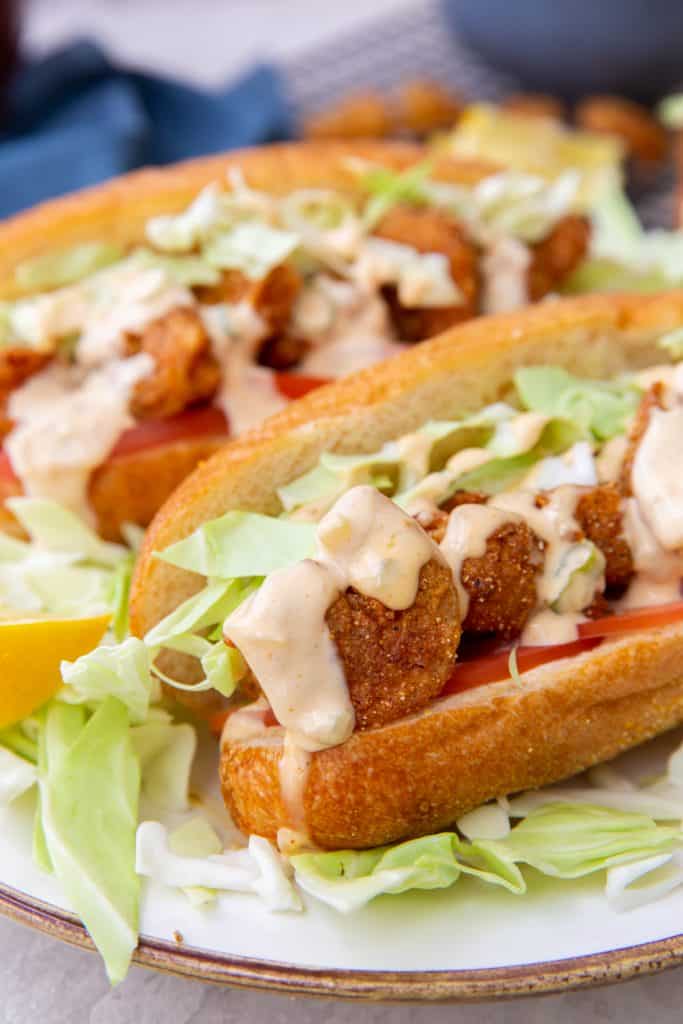 Upclose Shot Shrimp Po Boy Sandwich Drizzled with Remoulade Sauce