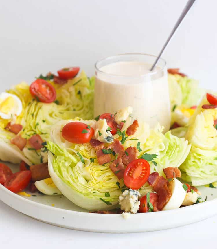 Iceberg Lettuce, tomatoes, and bacon with Dressing