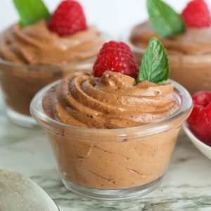 Chocolate Mousse Topped with Raspberry and Mint Leaf
