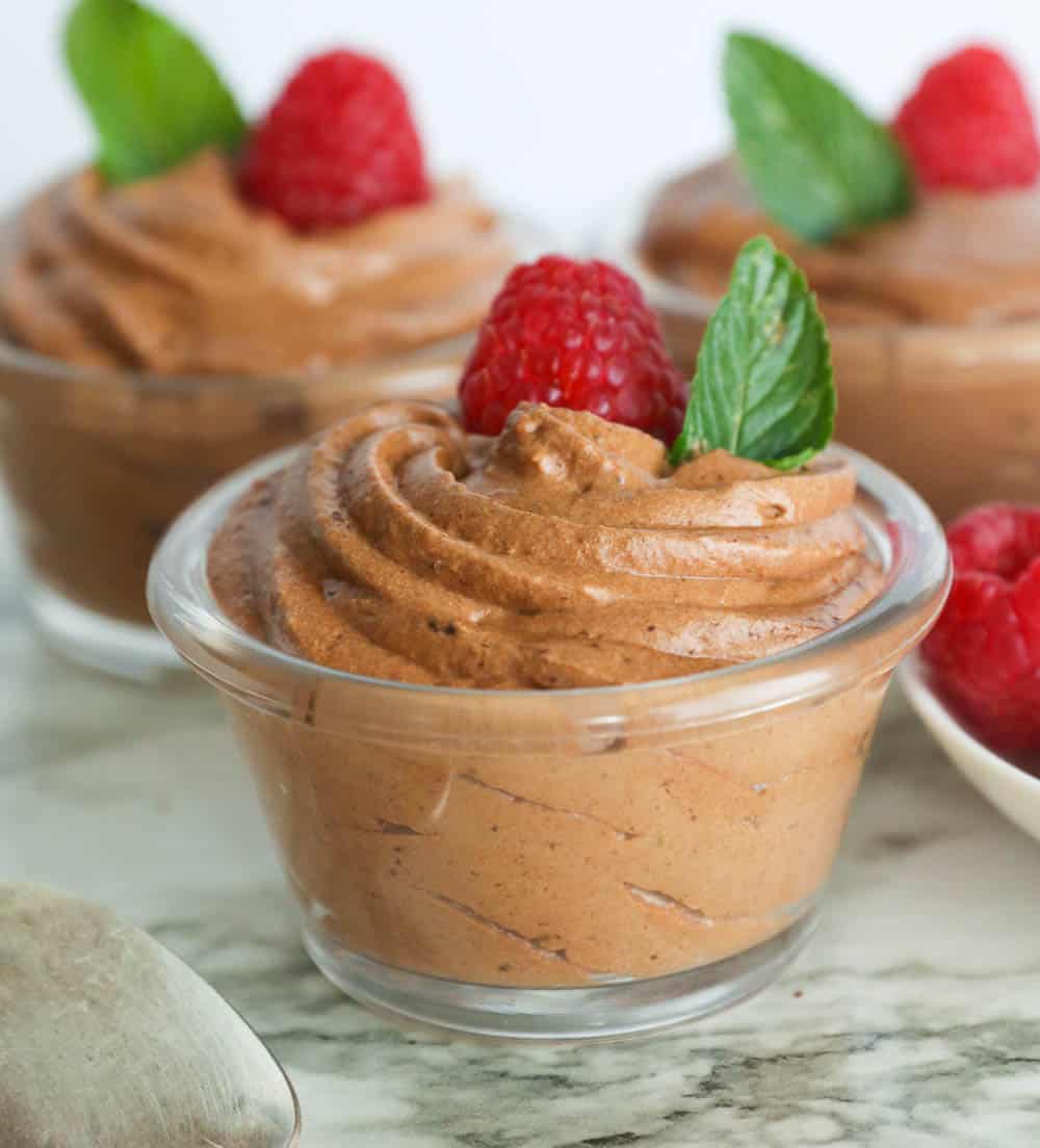 Chocolate Mousse Topped with Raspberry and Mint Leaf