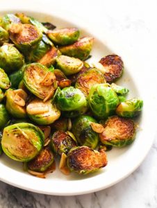 Sauteed brussel sprouts on a white dish