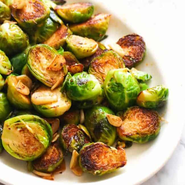 Sauteed brussel sprouts on a white dish