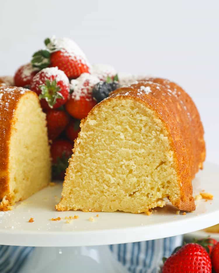 Sliced sour cream pound cake filled with fresh berries