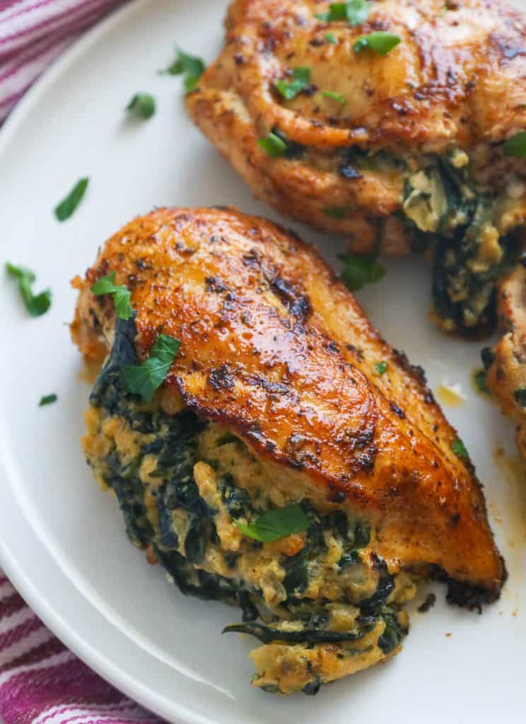 Spinach Stuffed Chicken Breasts on white plate