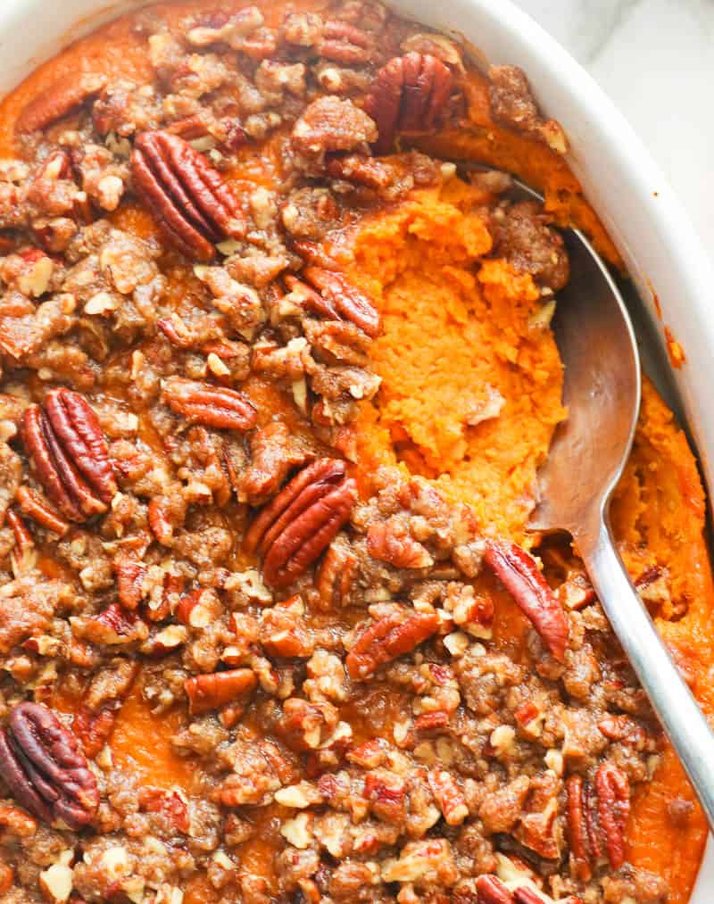 Scooped Out Sweet Potato Casserole topped with Pecans
