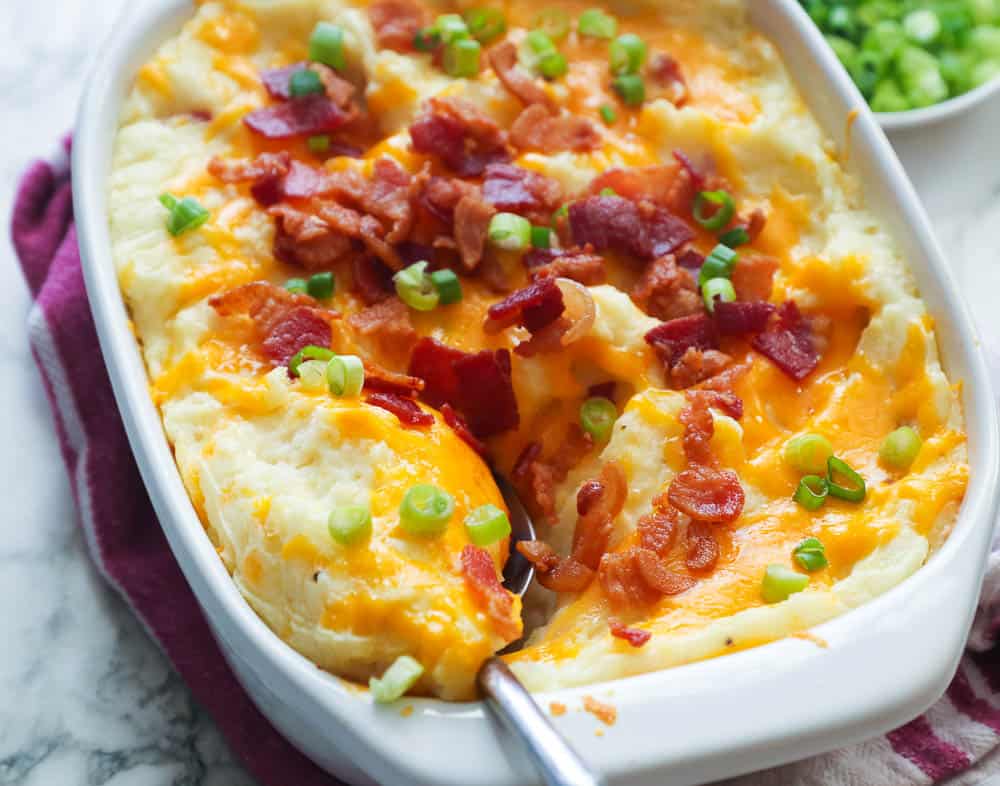 Loaded Mashed Potato Casserole with spoon