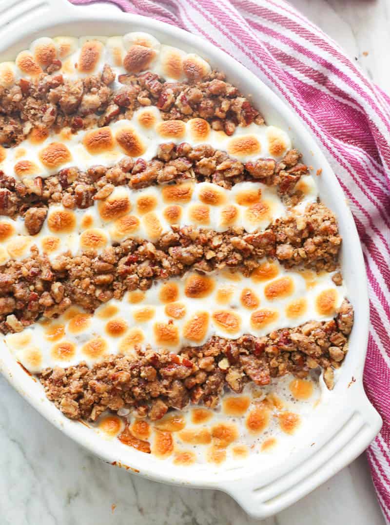 Sweet potato casserole with pecans and marshmallows.