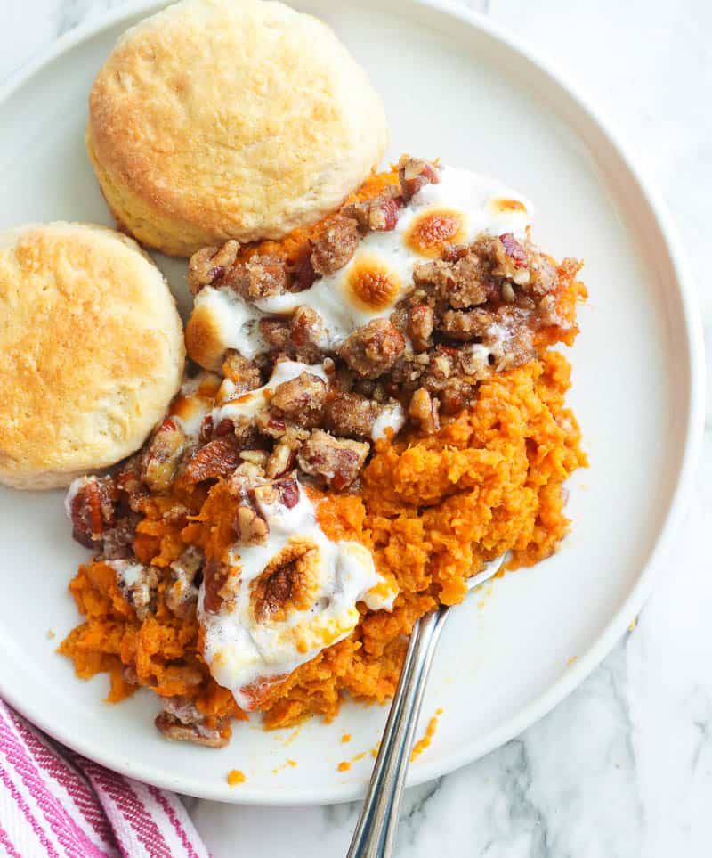 A single serving of sweet potato casserole dessert on a white plate